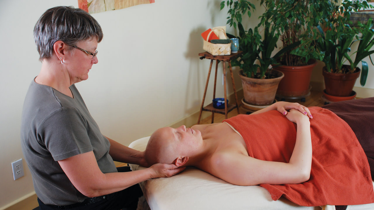 Massage therapist with patient